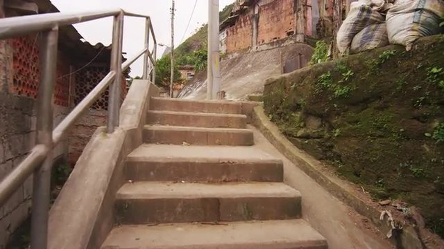 RIO DE JANEIRO, BRAZIL - JUNE 23: Tracking Shot through a well-traveled path of a favela