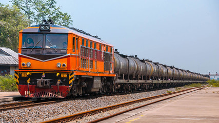 Fototapeta na wymiar Passenger train passing through rural station, 2015.