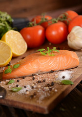 Smoked salmon slice on wooden board