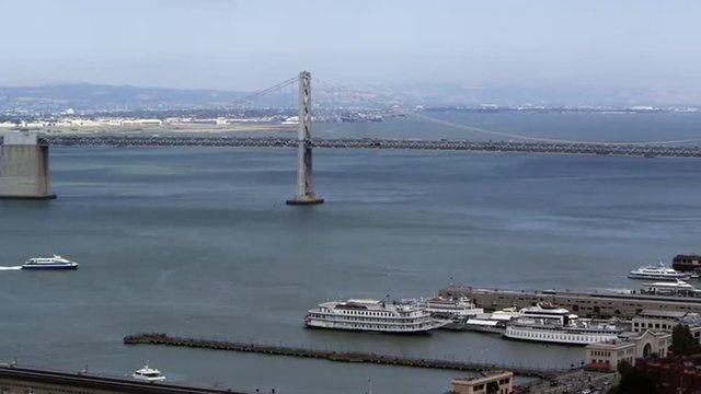 Pan of San Francisco Bay Bridge and buildings