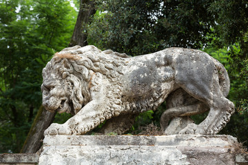 Fototapeta na wymiar Lion sculpture in Garden of Villa Borghese. Rome, Italy