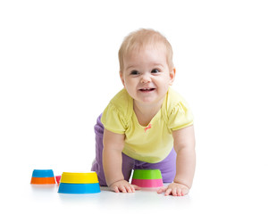 Cute little child is playing with toys 