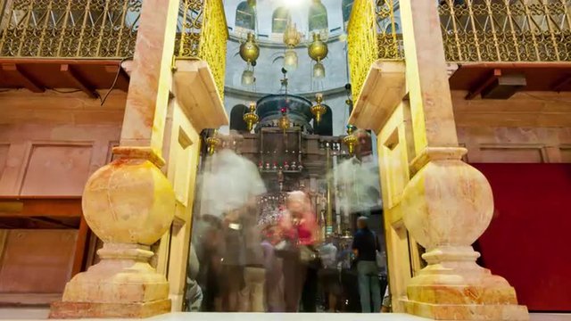 Entrance of the Edicule of the Holy Sepulchral time-lapse of tourists walking around.