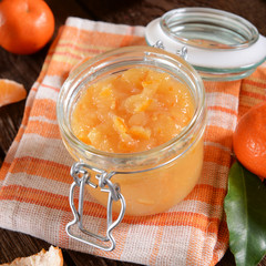 tangerine jam in glass jar