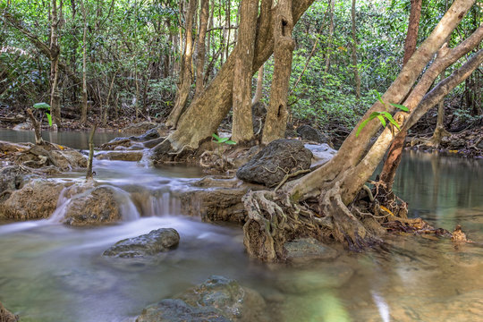 Fototapeta tropical waterfall in deep forest of Kanchanaburi province, Thailand