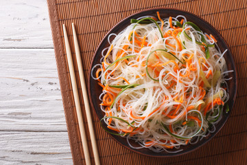 crystal noodles with cucumber and carrot on a plate horizontal top view
