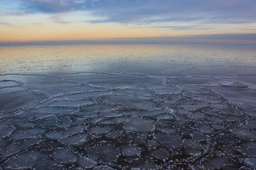 Frozen lake (or sea) like mirror at dawn