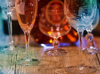 Wine bottle and glasses. Tinted image. Low depth of field 