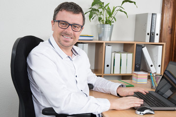 Business man using laptop at office working