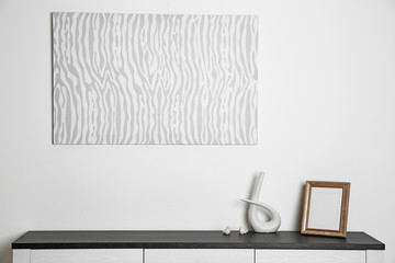 Abstract picture with frame and vase on a white wall background
