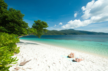 Couple on a tropical beach. Rawee Island ,Thailand