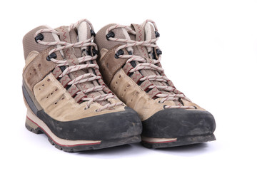 Used hiking boots isolated on white background