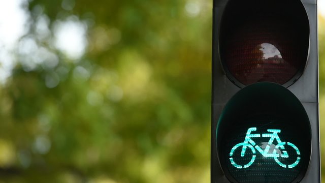 Bicycle traffic light switched from green to red color 