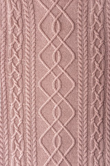 Pink figured sweater background vertical