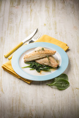 fish fillet with fresh spinach