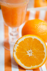 Oranges cut set on stripped white-orange mat