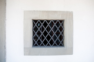 Old metal fence of building of the windows in Vinci ,italy