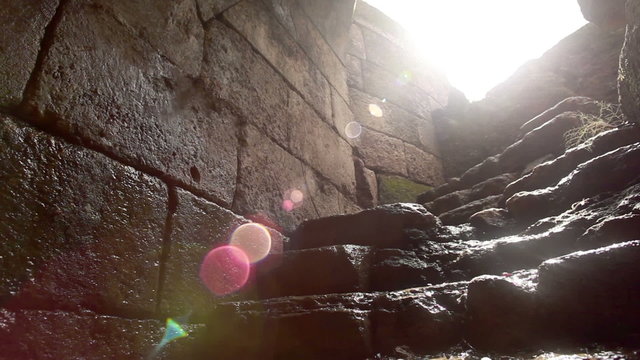 Stock Footage of water trickling down ancient stone steps in Israel.