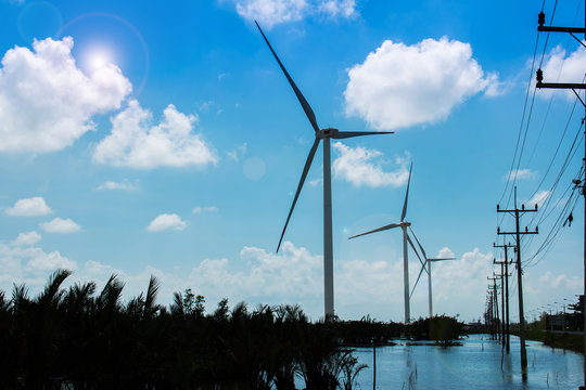 wind turbine generating electricity on blue sky