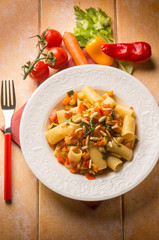 pasta with mixed vegetables and pine nuts