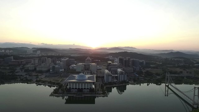 Aerial footage of Sultan Mizan Zainal Abidin mosque also known as the Iron Mosque or Masjid Besi, and the Palace of Justice, Court of Malaysia Putrajaya taken during sunrise