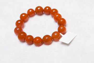 Chinese bracelet made of red round agate stones