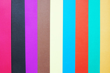 Stripped background made of multicolored paper sheets