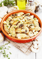 Chicken wings baked with mushrooms