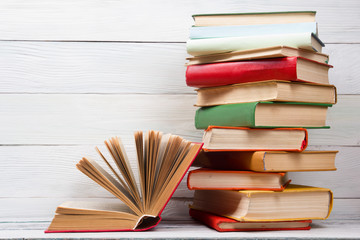 Obraz premium Open book, hardback books on wooden table. Back to school. Copy space