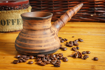 Clay Cezve. Coffee beans on the wooden table