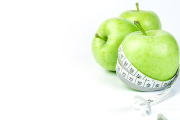 green apple with Measuring tape on white background 