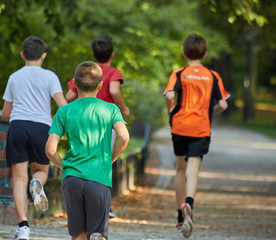 Boys running in park