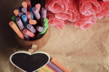 Colorful chalk with black heart