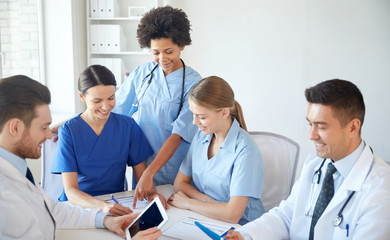 group of happy doctors meeting at hospital office