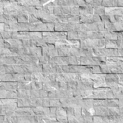 Gray stone block wall background and texture