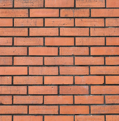 Red brick stone wall seamless background and texture