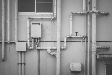 Pipeline water detail at industrial building wall