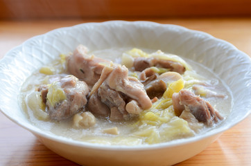 chicken stew on wooden tray