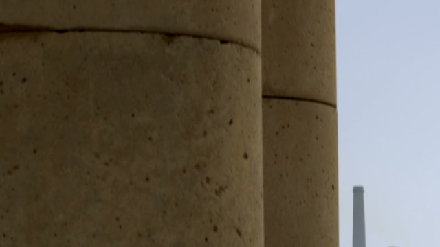 Royalty Free Stock Video Footage of ancient columns and smokestacks shot in Israel at 4k with Red.