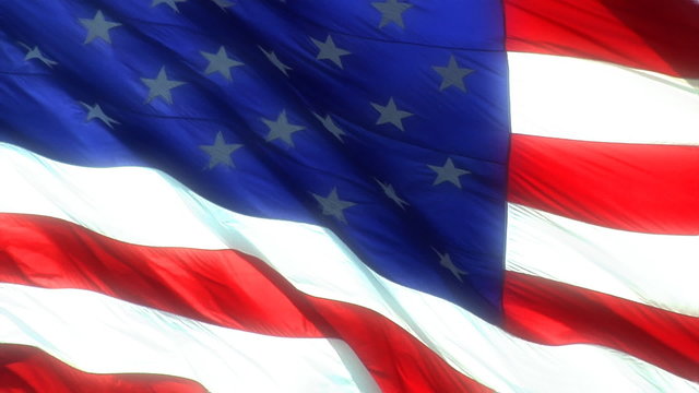 A closeup of a waving American flag.