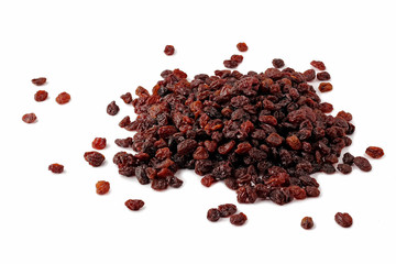 Scattering of dark raisin on a white background.
