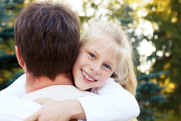 Fototapeta premium adorable father and daughter have fun together happy smiles. hea