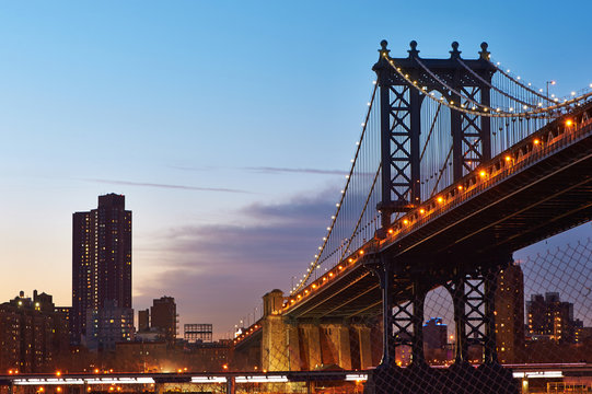 Manhattan Bridge and skyline silhouette view from Brooklyn at sunset