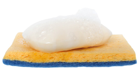 Wet soap with foam on the cleaning sponge close up