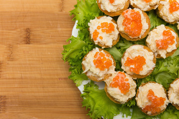 tartlets with red caviar and cheese appetizer