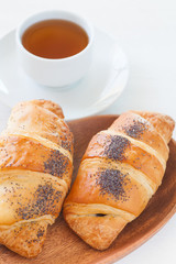Fresh and tasty croissant and hot tea
