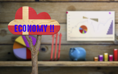 wooden sign indicating the economy