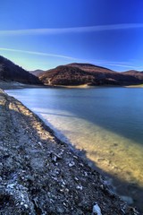 Beautiful landscape with pond and blue sky