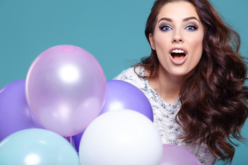 Fototapeta premium Happy young woman with colorful latex balloons,