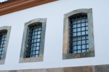 Tiradentes, BRAZIL - january 08, 2016:  Detail of the old prison window (Unesco  World Heritage)